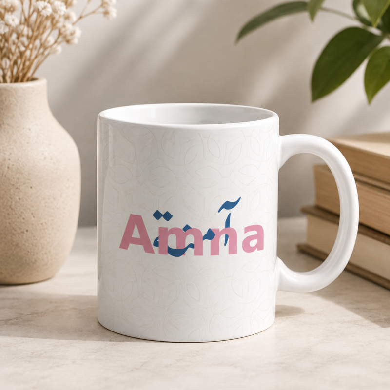 White Amina personalized name mug with pink lettering and blue decorative design