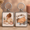 Cute aesthetic keychain with cozy woman journaling and sleeping cat with coffee and book artwork
