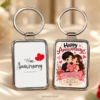 Happy Anniversary keychain with romantic hearts and couple artwork