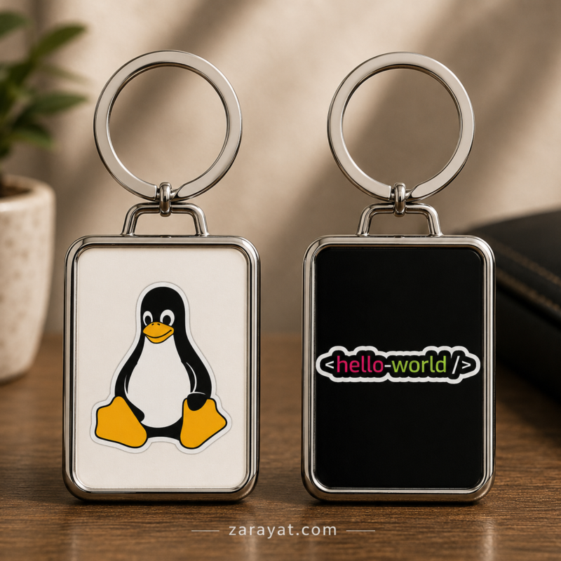 Linux keychain with penguin design and hello-world coding graphic