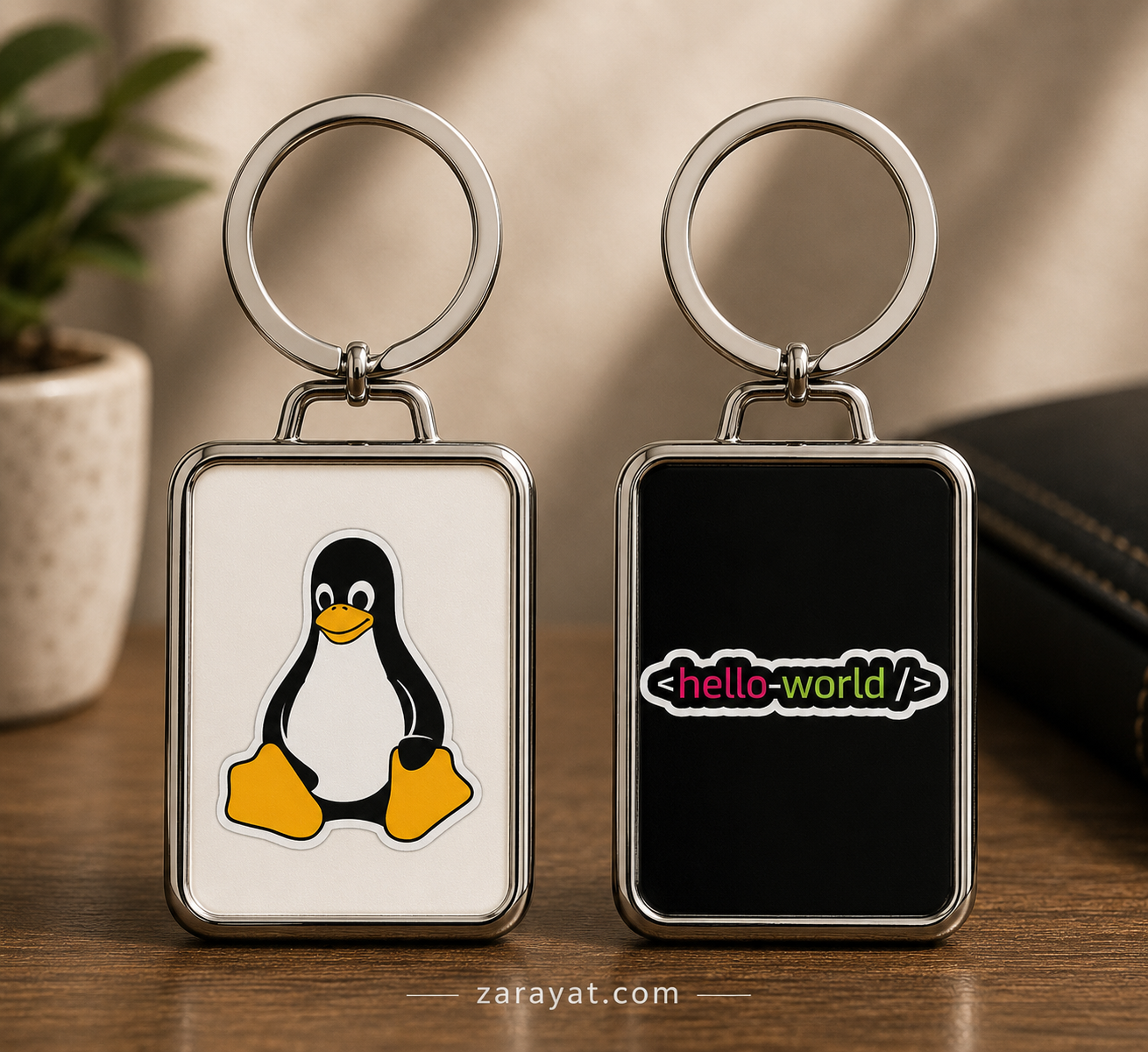 Linux keychain with penguin design and hello-world coding graphic