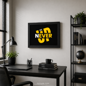 Never Give Up motivational wall art in a black frame above a modern office desk
