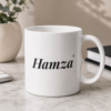 White personalized Hamza name mug with elegant black typography and decorative sparkle