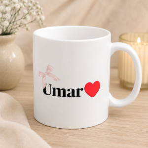 White personalized Umar name mug with black lettering, red heart and pink bow