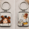Cute sewing keychain featuring illustrated girl, black cat and sewing machine artwork