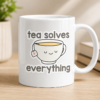 Cute Tea Solves Everything sticker design with smiling tea cup illustration