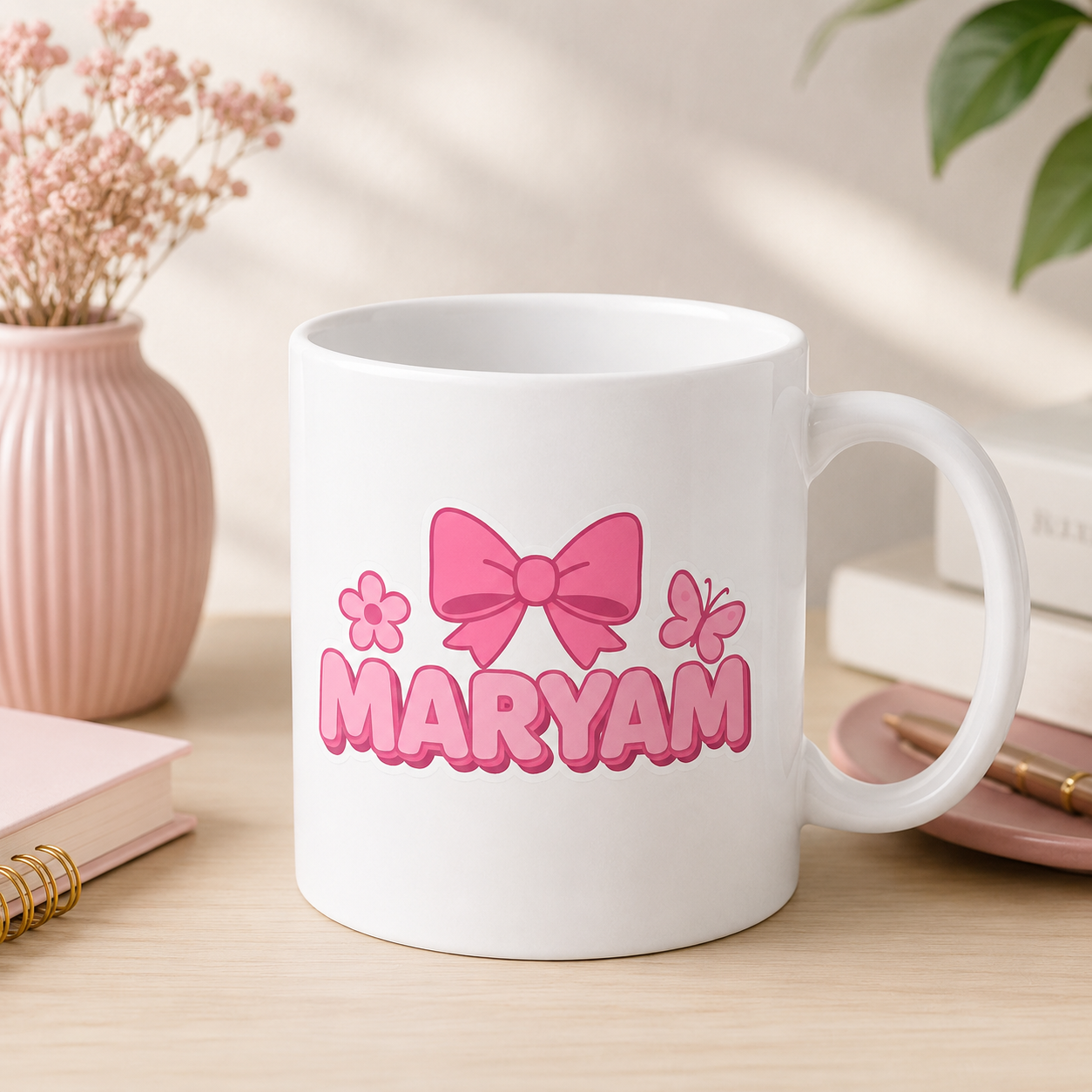 White personalized Maryam name mug with pink bow, flower and butterfly design