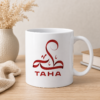 White personalized Taha name mug with red Arabic-style calligraphy and TAHA lettering