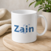 White Zain personalized name mug with blue Arabic calligraphy-style design